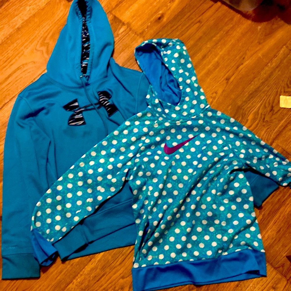 One under armor jacket and one nike jacket